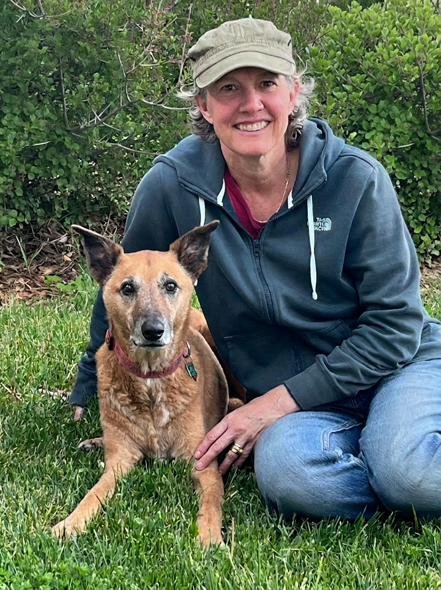 Allison, certified canine massage practitioner, with a calm dog in Montana